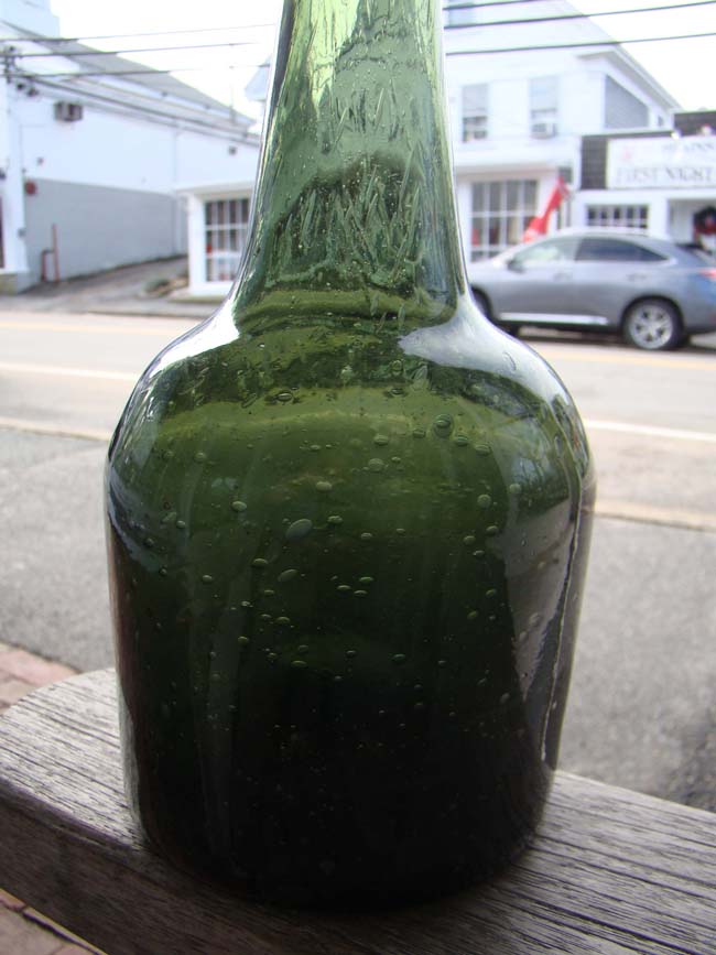 An unusually tall and rare 18th century English green glass wine bottle circa 1740 — image 2